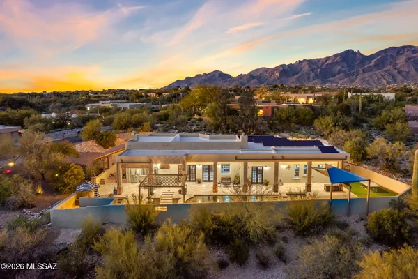 an aerial view of residential houses and outdoor space