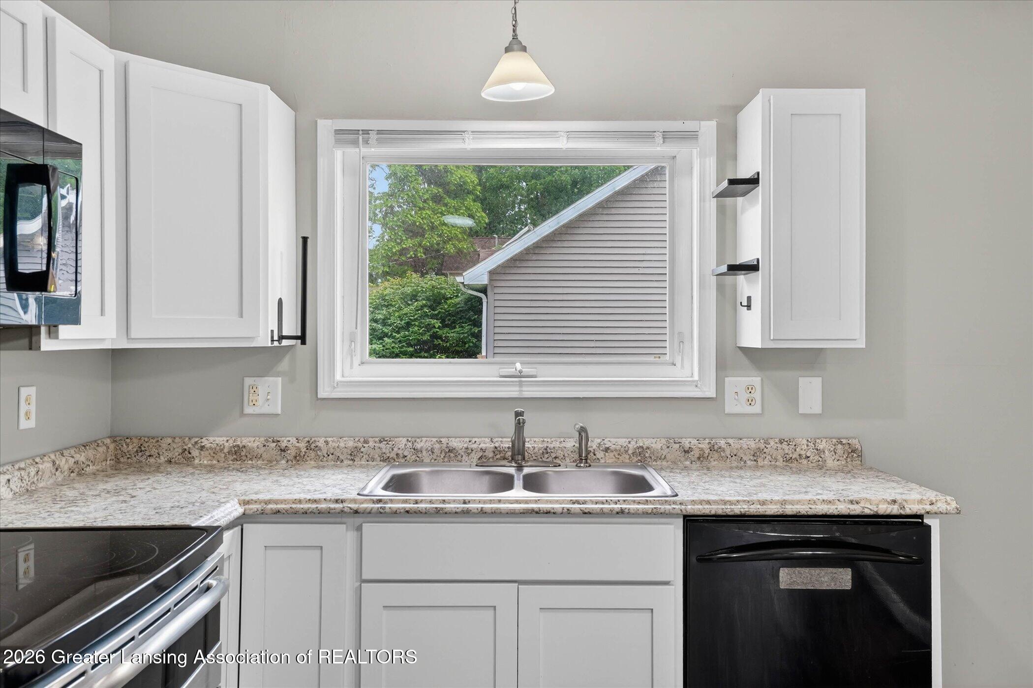 5105 Hughes Road Lansing, MI 48911 - Photo 10 of 26 13-5105-Hughes-Rd-WindowStill-Photograph