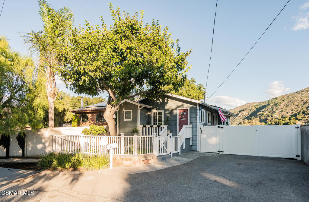 1088 Alta Vista Road Simi Valley, CA 93063 - Photo 2 of 24 front view of a house with a tree