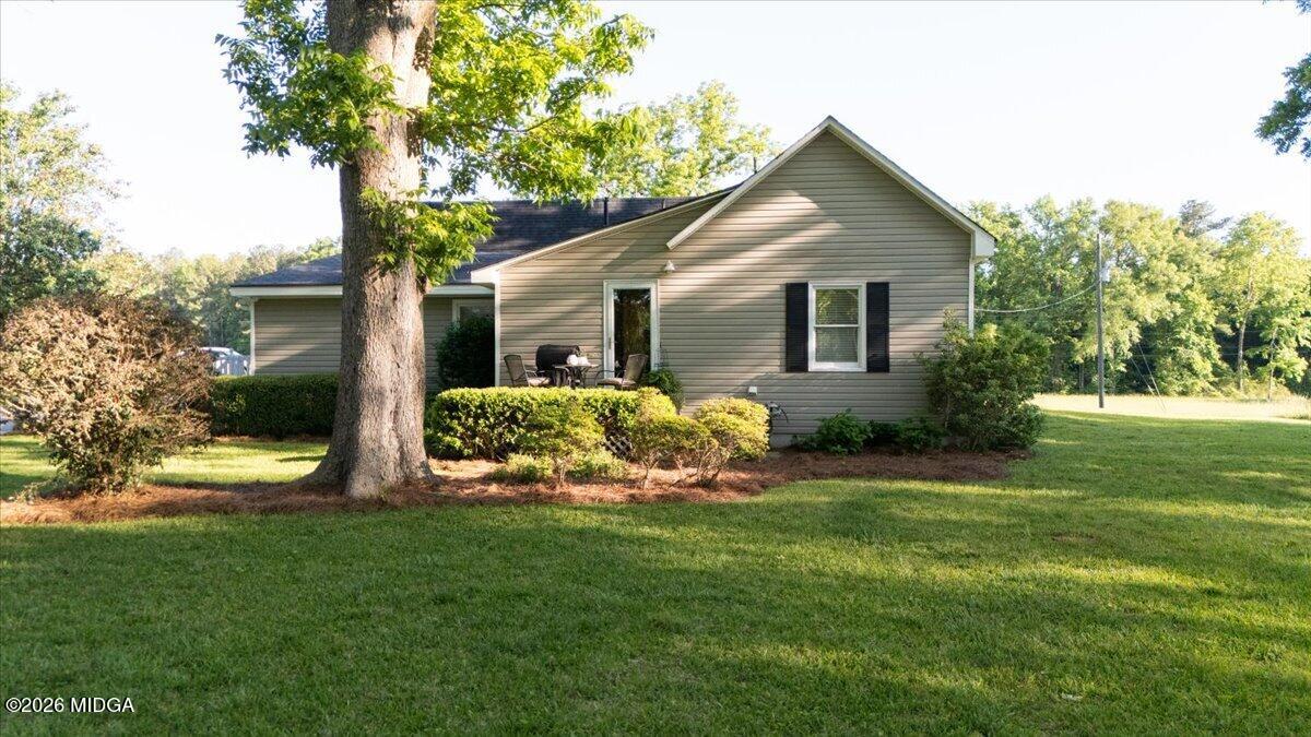 214 Howard Roberts Road Gray, GA 31032 - Photo 28 of 36 a front view of house with yard and green space