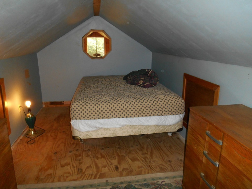 8 Victoria Avenue Rutland, MA 01543 - Photo 20 of 30 a bed sitting in a bedroom next to a lamp