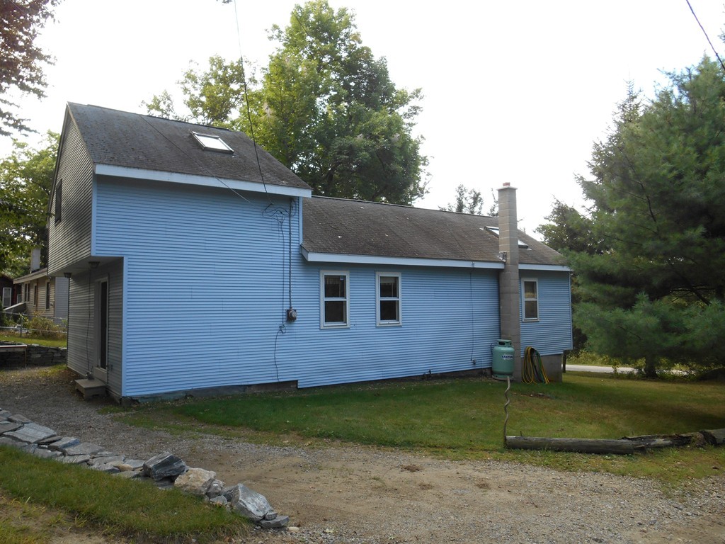 8 Victoria Avenue Rutland, MA 01543 - Photo 4 of 30 a front view of a house with garden