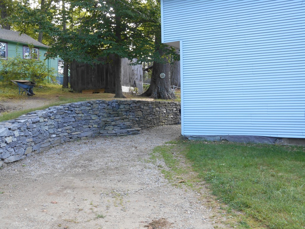 8 Victoria Avenue Rutland, MA 01543 - Photo 6 of 30 a view of a backyard with a garden