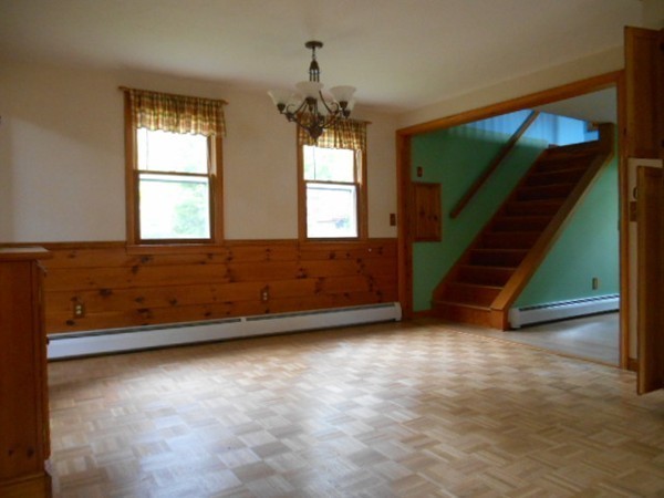 8 Victoria Avenue Rutland, MA 01543 - Photo 8 of 30 a view of an empty room with wooden floor and a window