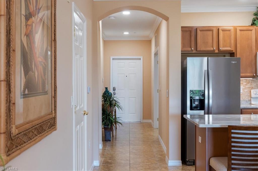 14981 Reflection Key Circle, Unit 322 Fort Myers, FL 33907 - Photo 26 of 35 a view of entryway with livingroom