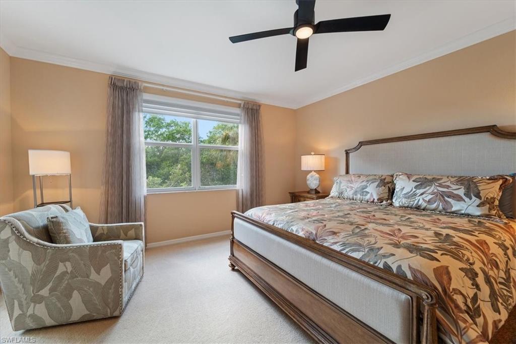 14981 Reflection Key Circle, Unit 322 Fort Myers, FL 33907 - Photo 30 of 35 a bedroom with a bed and window