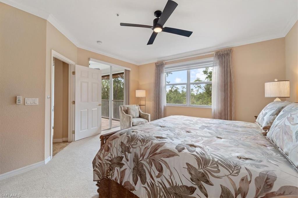 14981 Reflection Key Circle, Unit 322 Fort Myers, FL 33907 - Photo 32 of 35 a bedroom with a bed and a window