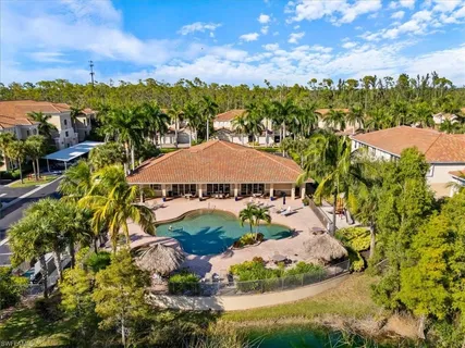 a living room with furniture and a flat screen tv with wooden floor