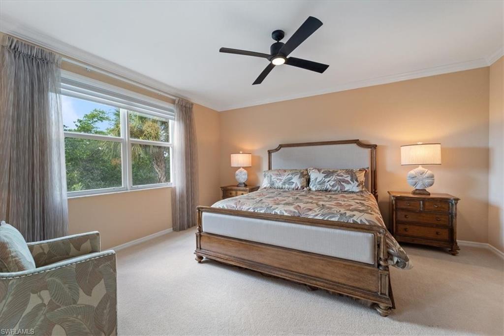14981 Reflection Key Circle, Unit 322 Fort Myers, FL 33907 - Photo 9 of 35 a bedroom with a bed and window