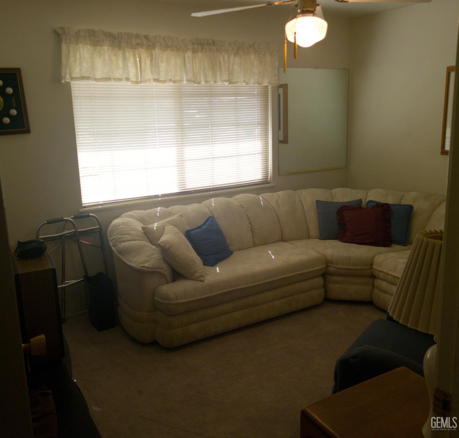 Undisclosed Address Bakersfield, CA 93309 - Photo 13 of 18 a living room with furniture and a window