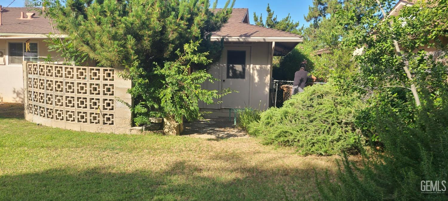 Undisclosed Address Bakersfield, CA 93309 - Photo 14 of 18 a view of a front of house with a yard