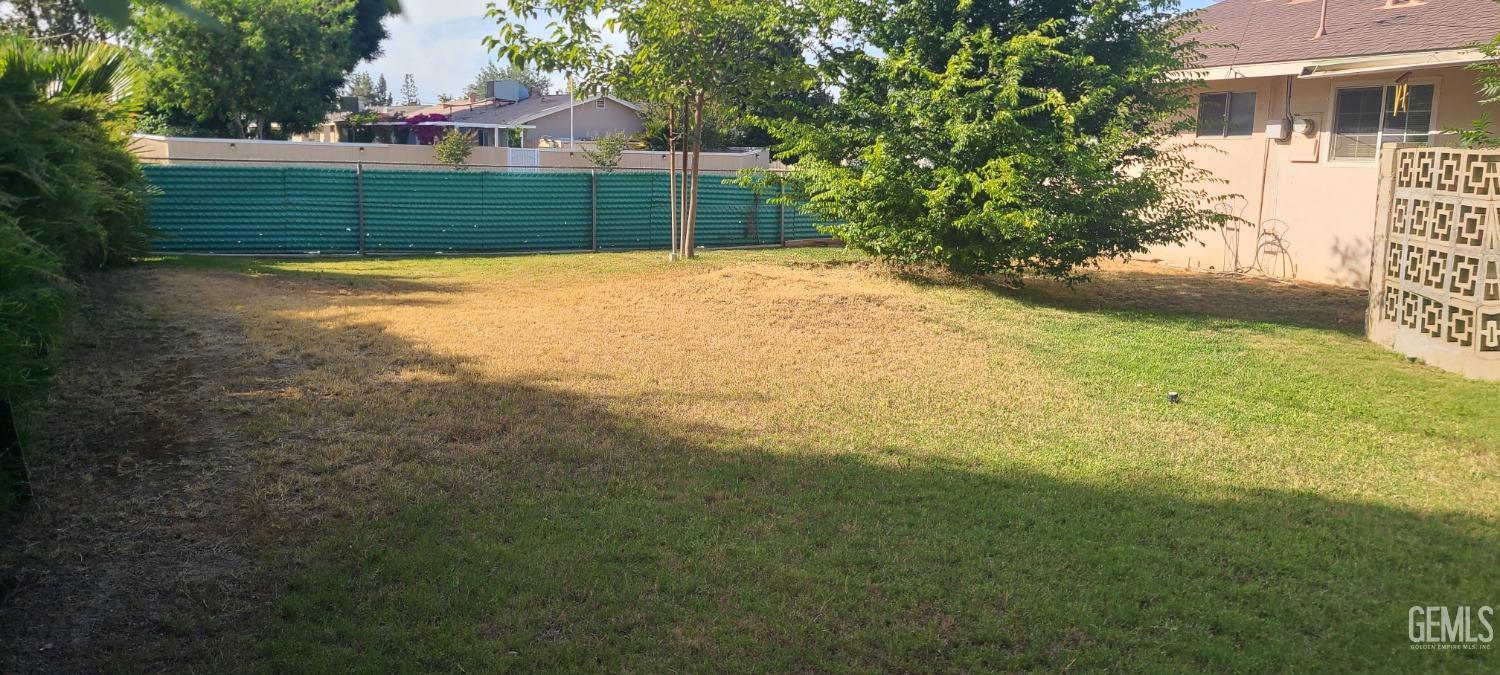 Undisclosed Address Bakersfield, CA 93309 - Photo 15 of 18 a view of a yard with a house