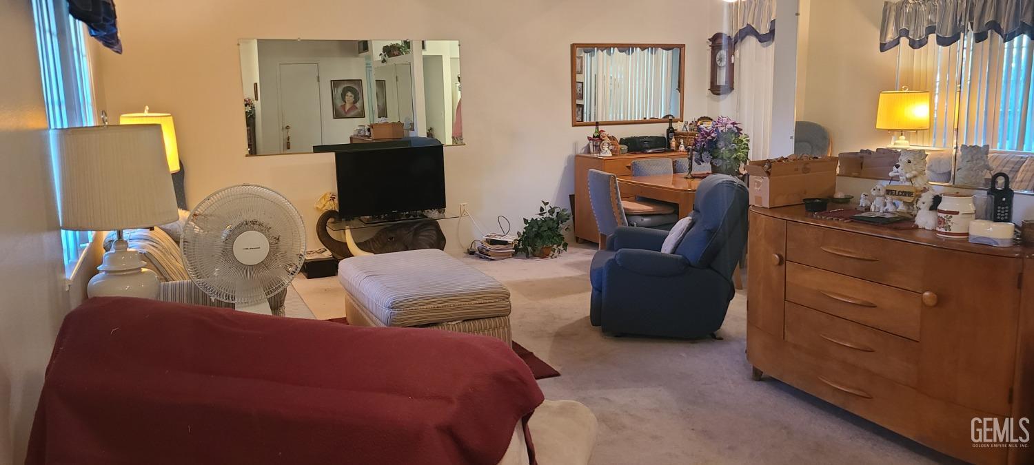 Undisclosed Address Bakersfield, CA 93309 - Photo 4 of 18 a living room with furniture and a mirror