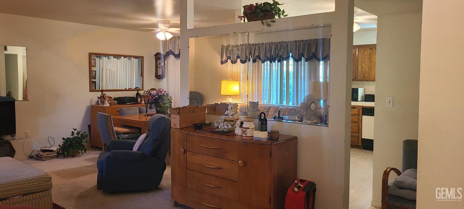 Undisclosed Address Bakersfield, CA 93309 - Photo 6 of 18 a view of a workspace with furniture and a window