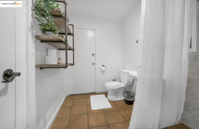 a bathroom with a toilet and a sink