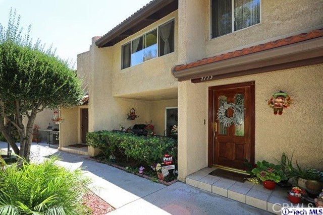 9773 Vía Roma Burbank, CA 91504 - Photo 1 of 1 a front view of a house with a yard