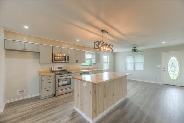 a view of a kitchen and dining room
