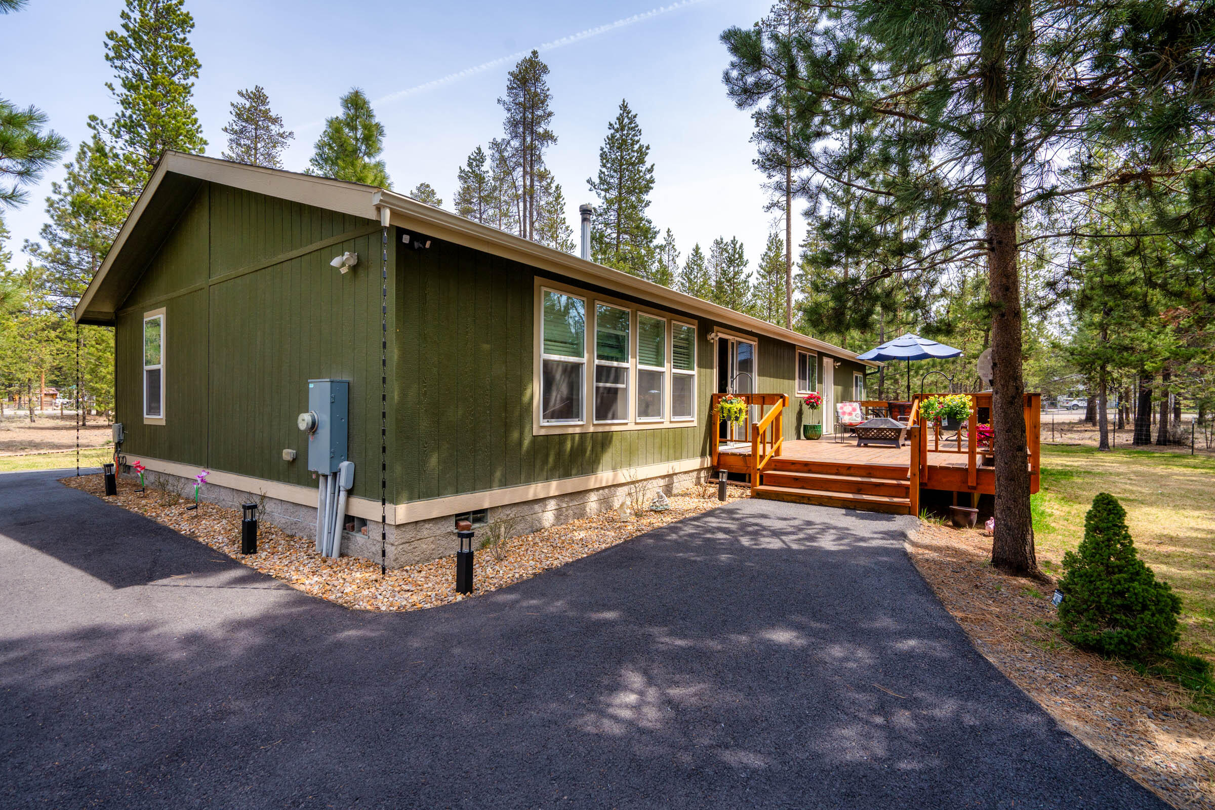 52648 Ammon Road La Pine, OR 97739 - Photo 4 of 44 a view of a house with a yard and sitting area