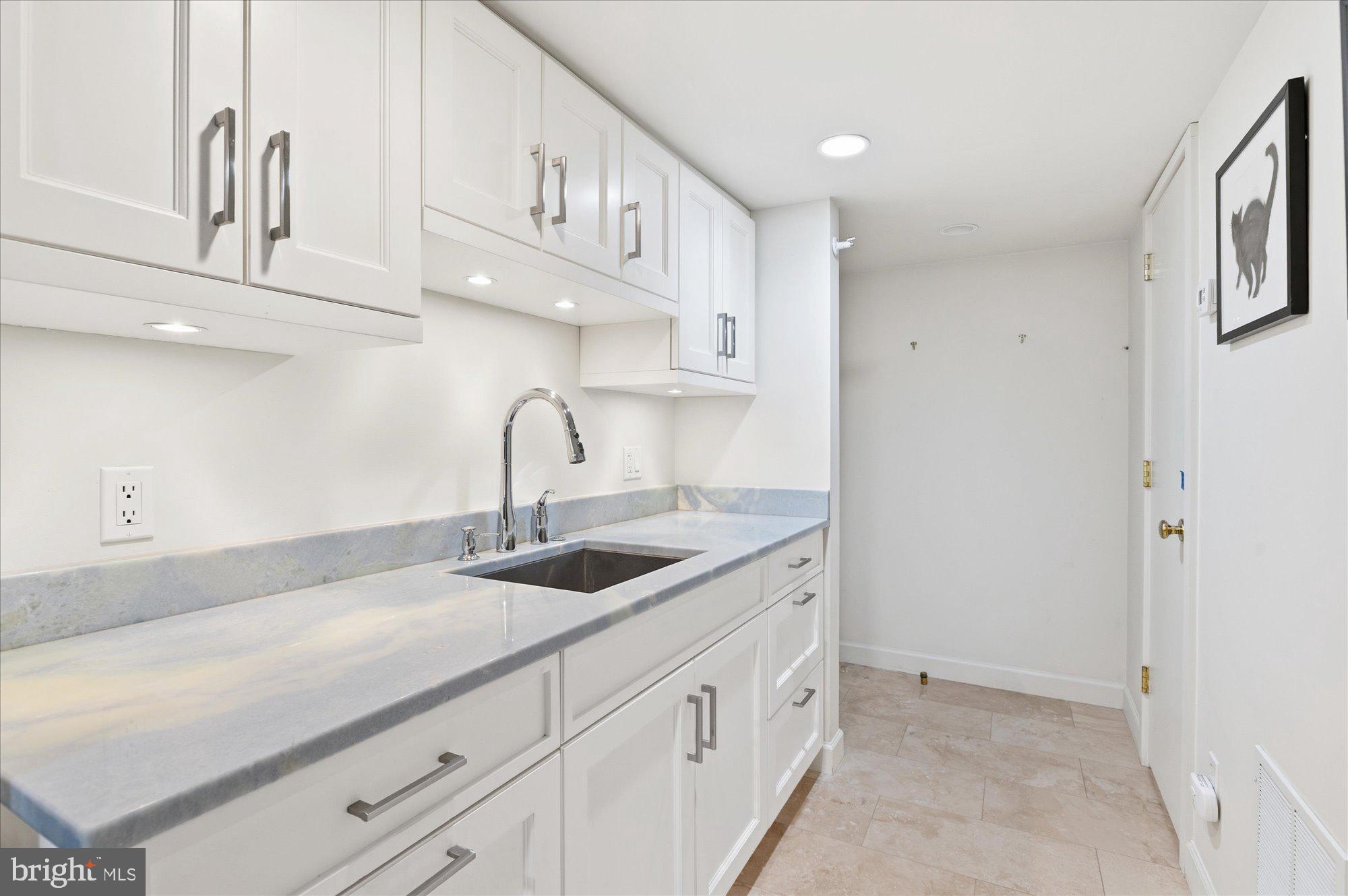 1615 35th Street Northwest Washington, DC 20007 - Photo 32 of 43 Lower level kitchenette