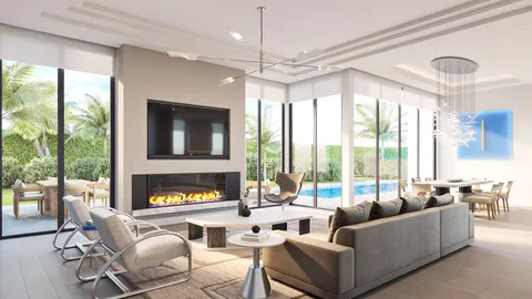 a living room with furniture fireplace and large windows