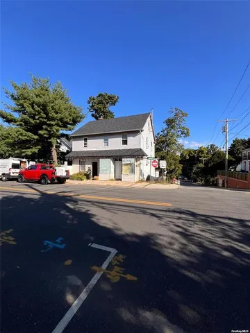 a view of street with lots of car parked on road