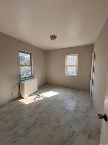 a view of empty room with windows