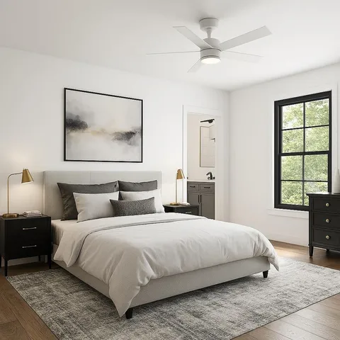 a bedroom with a large bed and a window