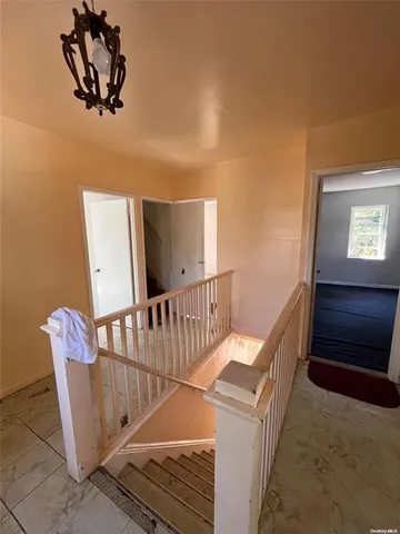 a view of a hallway with staircase