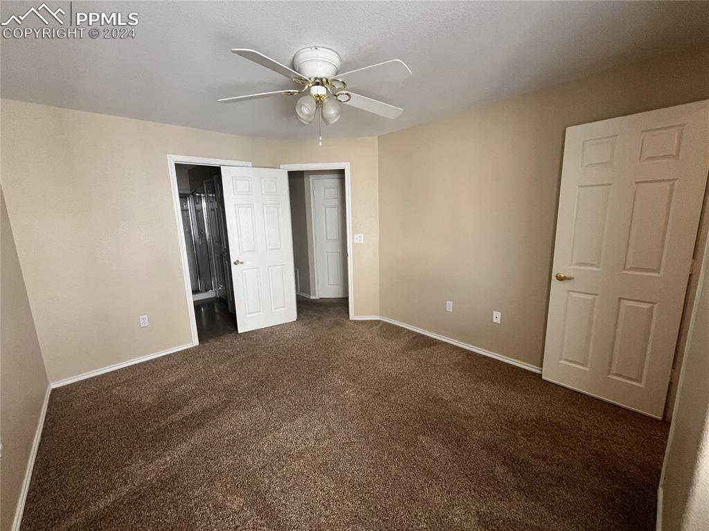 3731 Riviera Grove, Unit 203 Colorado Springs, CO 80922 - Photo 15 of 22 an empty room with closet and fan