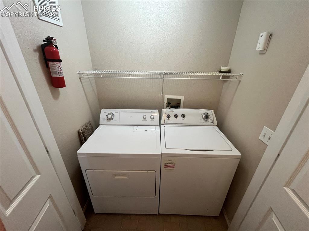 3731 Riviera Grove, Unit 203 Colorado Springs, CO 80922 - Photo 19 of 22 a utility room with dryer and washer