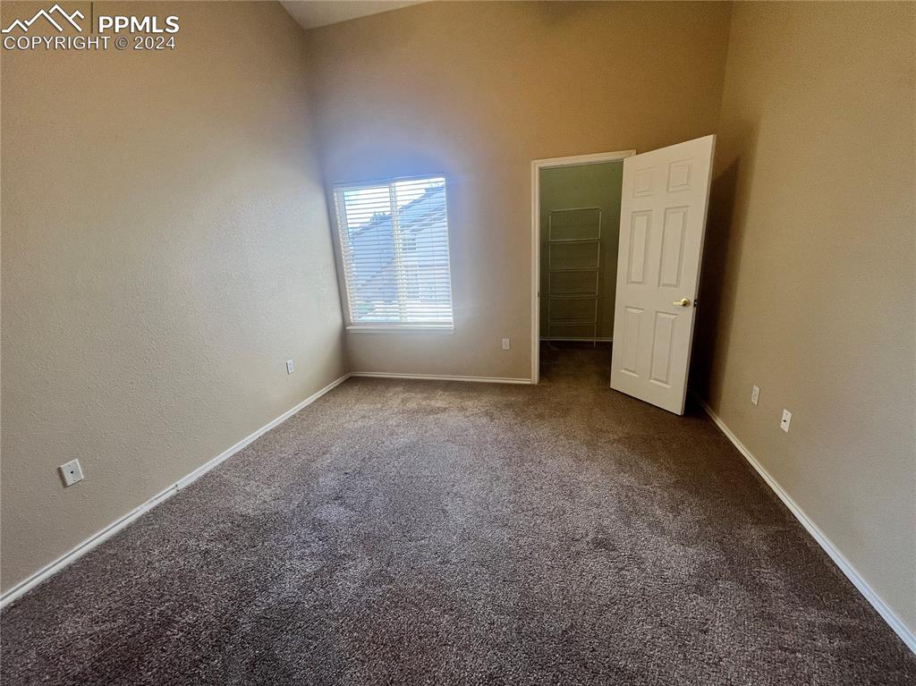 3731 Riviera Grove, Unit 203 Colorado Springs, CO 80922 - Photo 21 of 22 a view of an empty room with a window