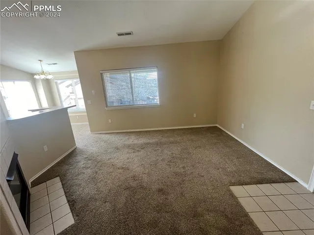 a kitchen with stainless steel appliances a refrigerator a sink a stove a microwave a sink