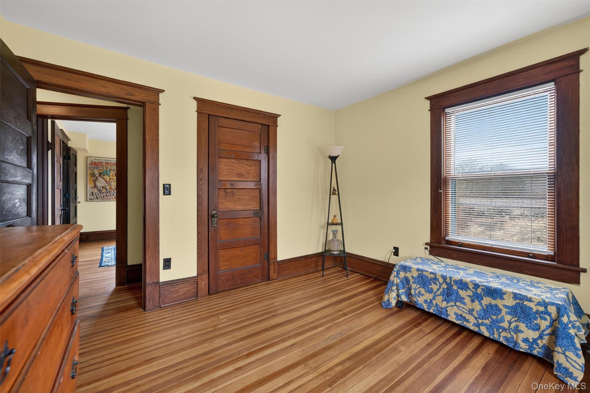 48 Kirks Road Narrowsburg, NY 12764 - Photo 30 of 50 Bedroom featuring dark wood-style flooring and baseboards