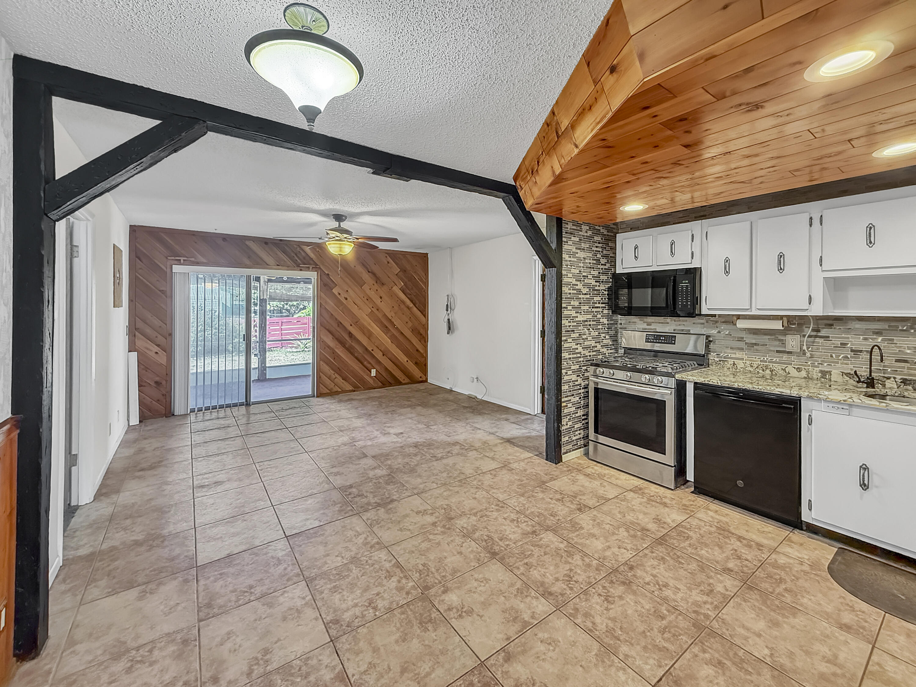4387 Appian Way Greenacres, FL 33463 - Photo 6 of 14 a view of a kitchen with microwave and cabinets