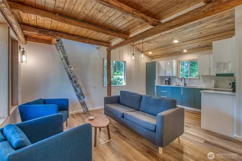 a living room with furniture and a painting