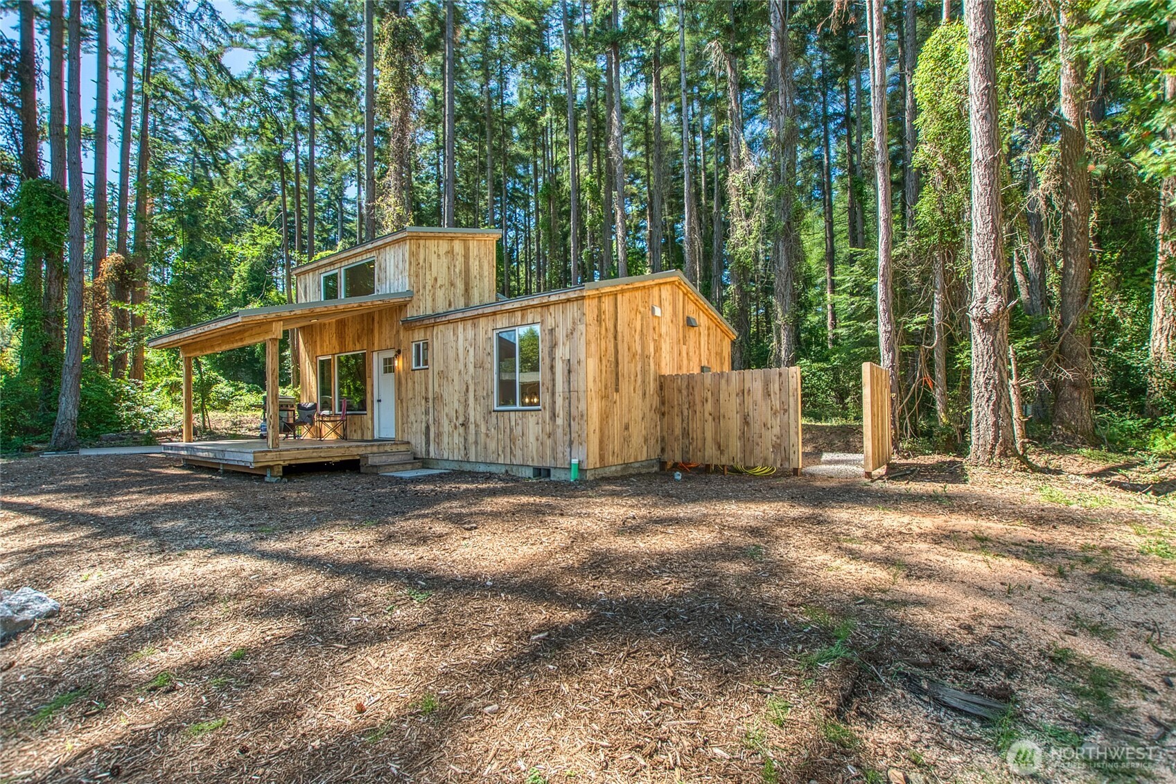 311 Enchanted Forest Road Orcas Island, WA 98245 - Photo 6 of 26 a view of a house with backyard and trees