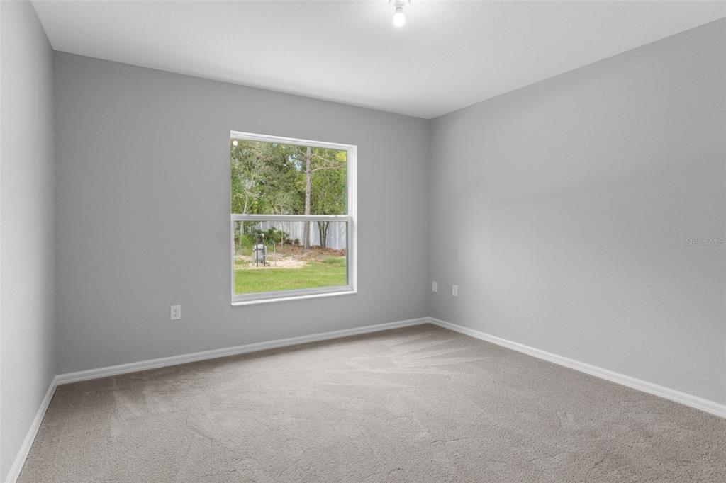 16375 Kakawi Road Brooksville, FL 34614 - Photo 28 of 30 an empty room with a window