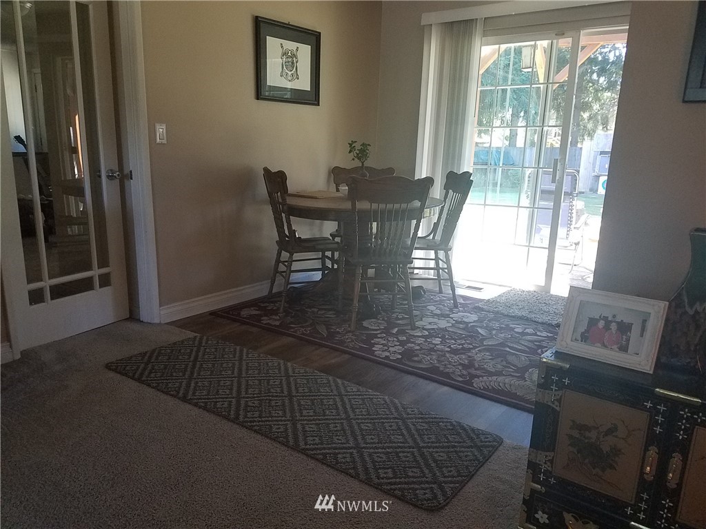 4601 Northeast 23rd Street Renton, WA 98059 - Photo 14 of 17 a view of a dining room with furniture and window