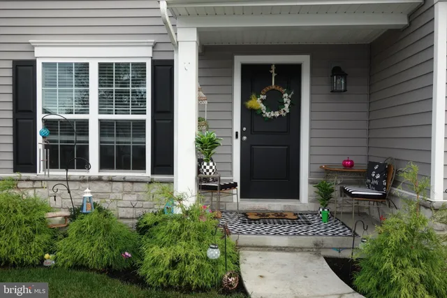 a front view of a house with a porch