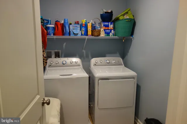 a utility room with dryer and washer