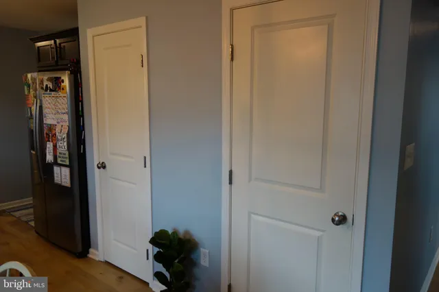 a room with wooden floor and closet