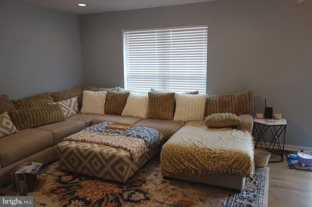 a living room with a bed and a couch