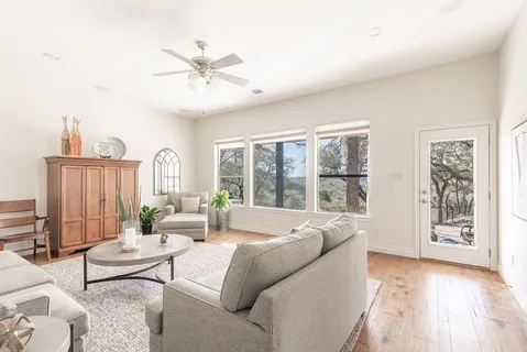 a living room with furniture and a large window