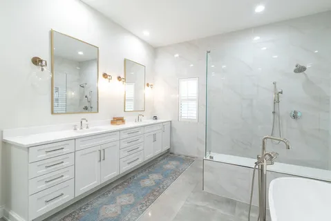 a bathroom with a double vanity sink mirror and double