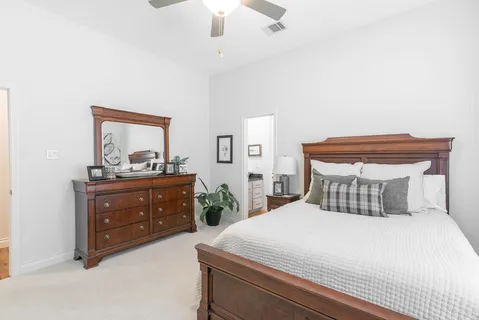 a bedroom with a bed and a dresser