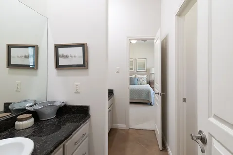 a kitchen with a granite countertop sink and a stove