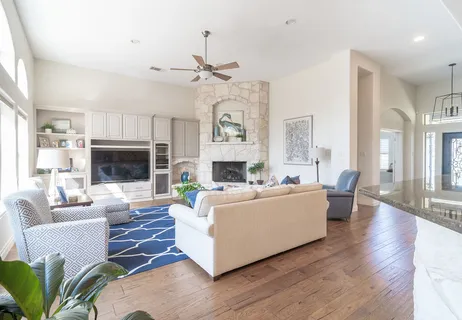 a living room with furniture fireplace and a flat screen tv