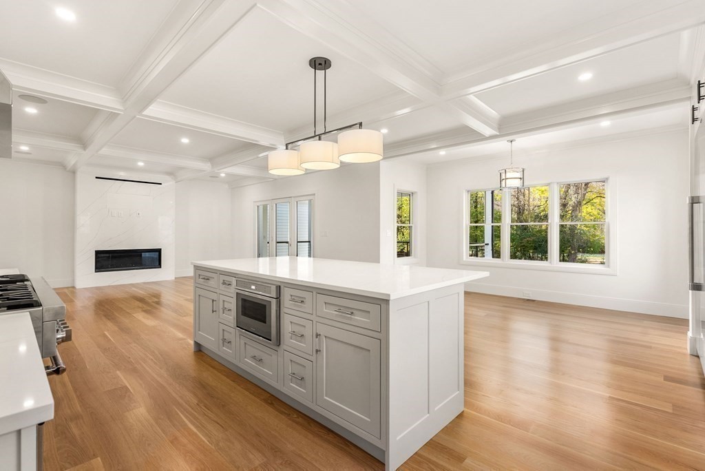 21 Beechnut Road Westwood, MA 02090 - Photo 12 of 41 a kitchen with stainless steel appliances granite countertop a stove and a wooden floors