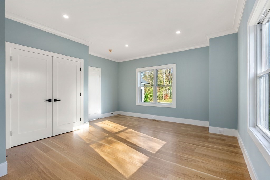 21 Beechnut Road Westwood, MA 02090 - Photo 15 of 41 a view of an empty room with a window and wooden floor