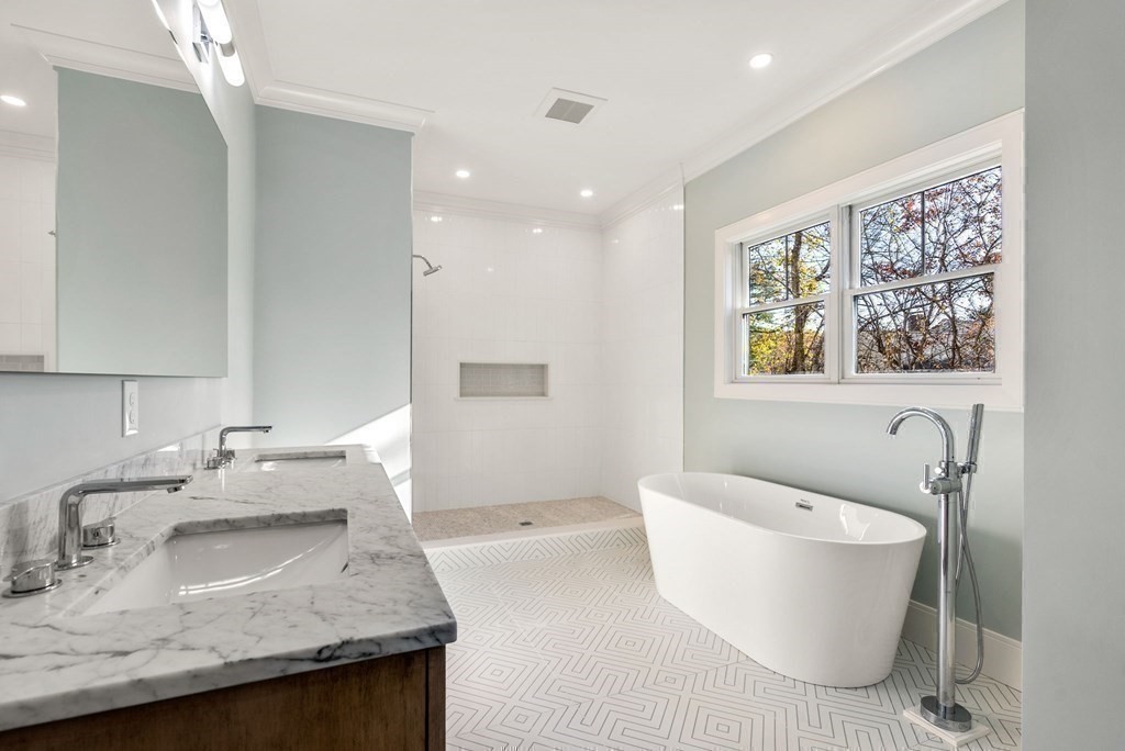 21 Beechnut Road Westwood, MA 02090 - Photo 18 of 41 a bathroom with a granite countertop sink and mirror with bathtub
